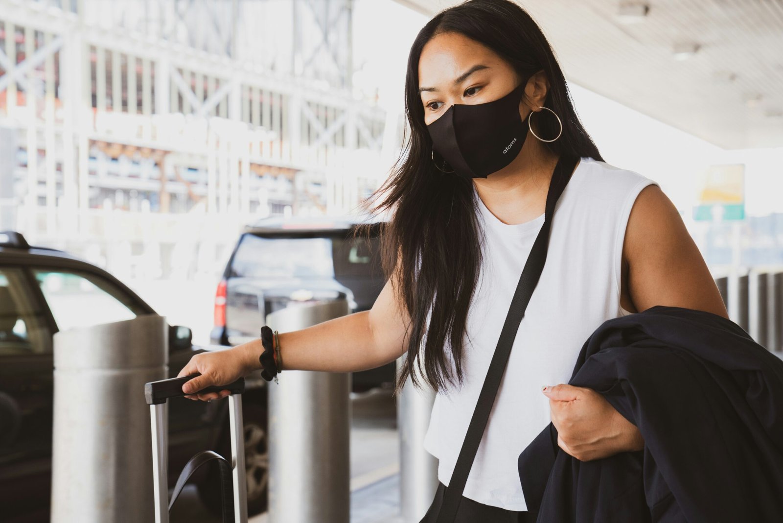 woman in black and white tank top wearing black sunglasses